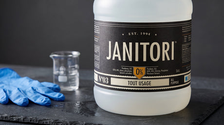 Close view of the JANITORI No.03 all-purpose cleaner label on a dark slate counter